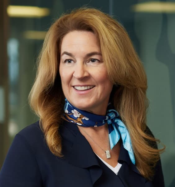 White middle aged woman with a neck scarf